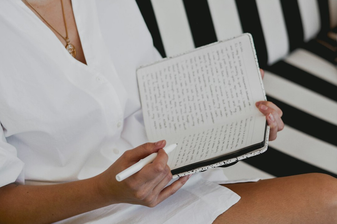 person journaling emotions