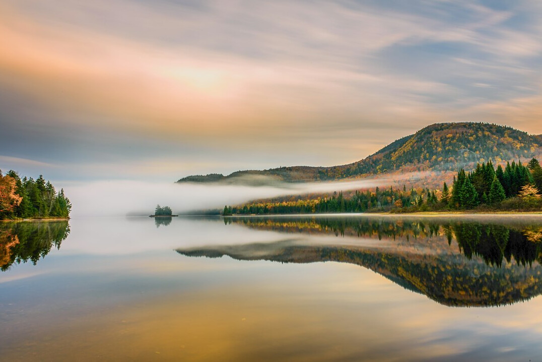 sunrise over calm lake