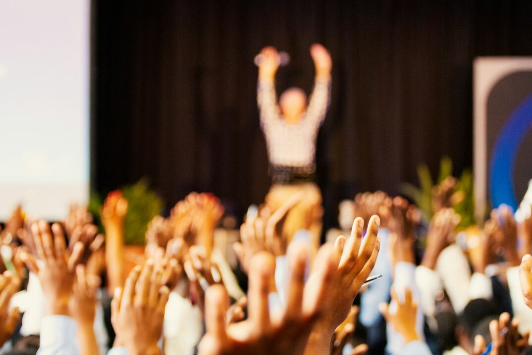 confident speaker presenting to audience