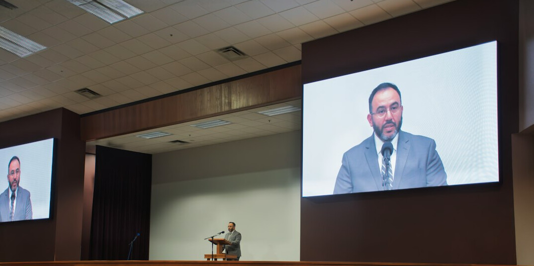 man speaking at conference