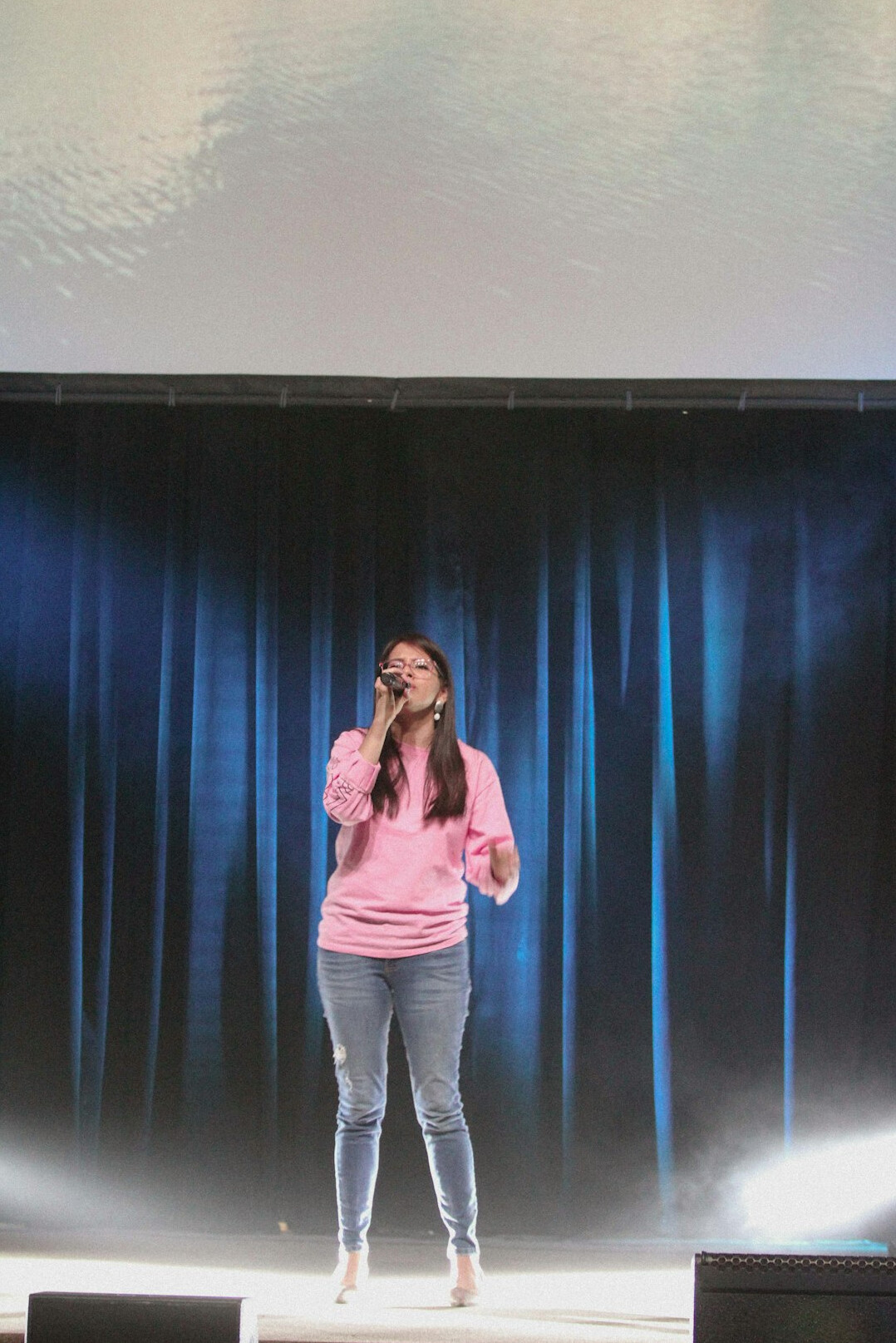 confident speaker on stage